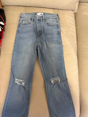 Fashion Nova Light Blue Flare Jeans with Knee Rips. Small